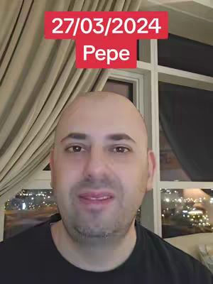 A man with a shaved head is centered in a selfie-style shot. Above him is a red rectangular box containing the date '27/03/2024' and the name 'Pepe' in white lettering. The background shows a window with a cityscape visible through it, curtains and a dark wall, suggesting an indoor setting.