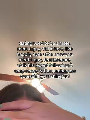 The image shows a person with their head down, likely in a gesture of sadness or contemplation. The person's hair is visible, and their hands are brought up to their face. Above the person, the image features text that may serve as a hook, set against a plain, light-colored background, possibly a ceiling.