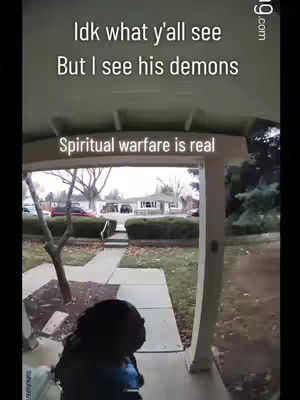 The cover image shows a view from under a porch or overhang. In the foreground, a person wearing a dark hoodie is partially visible. Behind that person is a threshold framed by architectural elements. Beyond the threshold, the background reveals a neighborhood scene with houses and trees. The sky is overcast. Text on top indicates the video's messaging.