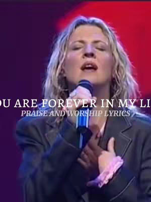 The cover image features a woman singing into a microphone. Text overlays include song lyrics in a white sans-serif font.