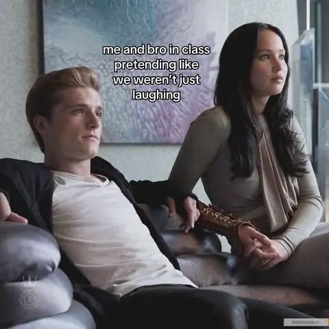 The cover image shows two characters from the Hunger Games movie franchise, possibly Katniss and Peeta, seated on a couch. The man on the left is wearing a white shirt with a dark jacket, and the woman on the right is in a long-sleeved top. Text overlays the image, adding context.