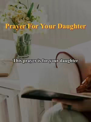 The image shows a bouquet of white flowers in a clear vase placed on a white surface. Below are two lines of text in a yellow and white color theme. In the background, appears to be a person's hand holding a book.