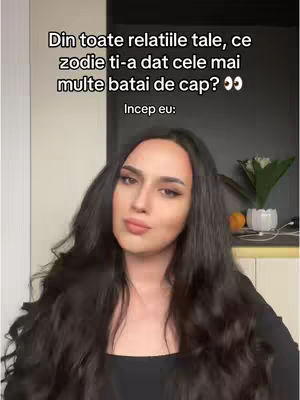 A woman with long dark hair poses in front of a blurry background. Text is added above her head.