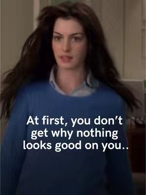 The cover image features a woman looking slightly to the side, with long hair. Overlaid on the image is the text: "At first, you don't get why nothing looks good on you.."