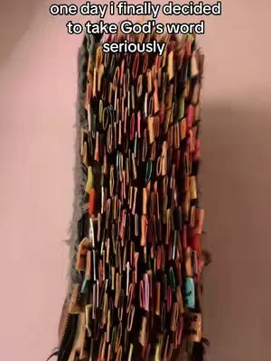 The cover image shows a close-up of a Bible with numerous colorful tabs sticking out from the pages. These tabs create a textured, layered effect, with the colors ranging from bright pink and yellow to muted tones. The book is positioned vertically, and the tabs cover most of its surface. The background is a plain, light-colored wall.