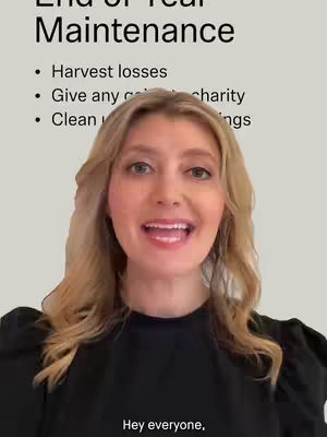 A woman with long blonde hair is centered in the frame, looking directly at the camera. She has a friendly expression with a slight smile. Above her head, text overlays read 'End of Year Maintenance' followed by a bulleted list. Below her, text appears that says 'Hey everyone'. The background is a light beige color.