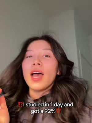 A young woman with long, dark hair is looking directly at the camera with an open mouth, as if speaking. Text overlays appear at the bottom of the frame.