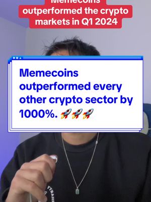 A man in a black sweater is shown in a selfie-style video, with a blue box overlay that displays text about memecoins outperforming the crypto market. The overlay includes text that reads, 'Memecoins outperformed every other crypto sector by 1000%.', accompanied by rocket ship emojis. Above the box is a red strip with more text, 'Memecoins outperformed the crypto markets in Q1 2024'. The background appears to be an office or a home setting with blurred elements, and the man is holding something in his hand.