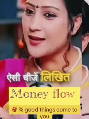 A woman with dark hair and professional makeup is the central figure, captured from the chest up. She is wearing a pink top/dress and a white pearl necklace. Her expression is a slight smile, and she is looking directly and invitingly at the viewer. The image is overlaid with text in both English and Hindi in a yellow box, suggesting a motivational or instructional theme.