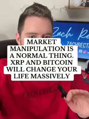 A man in a red shirt is centered in the shot, with a white block of text obscuring the lower half of his face. Behind him, a screen displays the text "Zach Re" in a stylized font, with the lower portion of the frame showing a glimpse of the room setting.