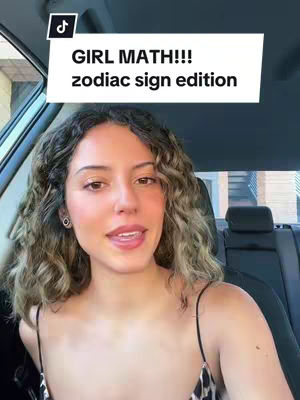 A woman with curly brown hair is sitting in a car seat, looking directly at the camera. She's wearing a sleeveless top with a patterned design. A white text box hovers above her, with text in black letters.
