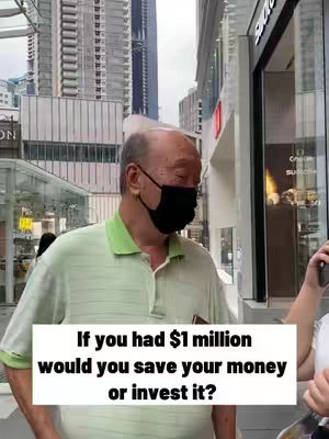 An older man in a mask is interviewed on the street. Text overlay asks: 'If you had $1 million, would you save your money or invest it?' He is facing left, in a city setting, with tall buildings in the background.