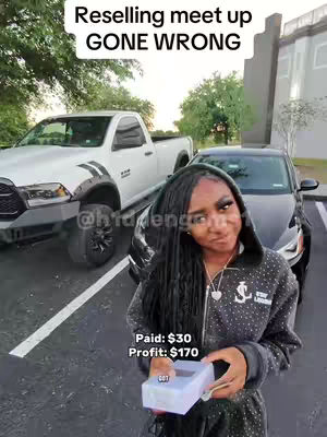 The image shows a young woman standing in front of a white pickup truck and a black car. She holds a small box and appears to be looking at the camera with a slightly skeptical expression. Text overlays indicate a 'Reselling meet up GONE WRONG' scenario, along with financial details.