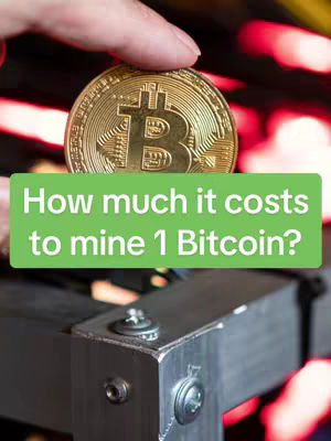 A hand holding a large gold Bitcoin coin above an image of what appears to be a metal mining rig, with text overlayed on a green rectangle.