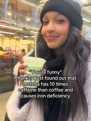 A woman with long dark hair wears a black beanie and a fur-lined coat, holding a matcha drink. Text overlays on the image provide additional context.
