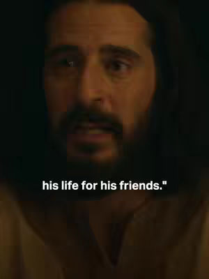 The cover image shows a close-up of a man's face, likely Jesus, with a serious or empathetic expression. The lighting is dim, creating shadows that emphasize his features. Text overlayed at the bottom reads 'his life for his friends.'
