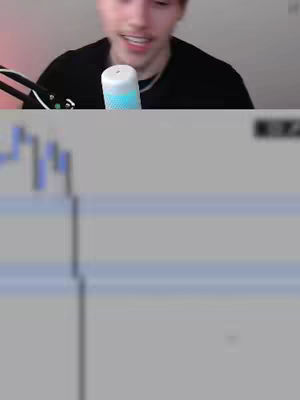 The cover image shows a young man in a black shirt looking at the camera. The top of the image cuts off the top of his head but includes his face and upper chest. He has light skin and short brown hair. A microphone and a blurred chart are also visible.