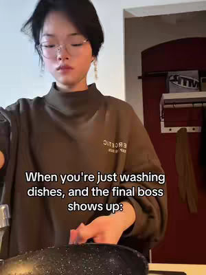 A woman with glasses stands at a kitchen sink, looking down at a dish. Text overlays the image.