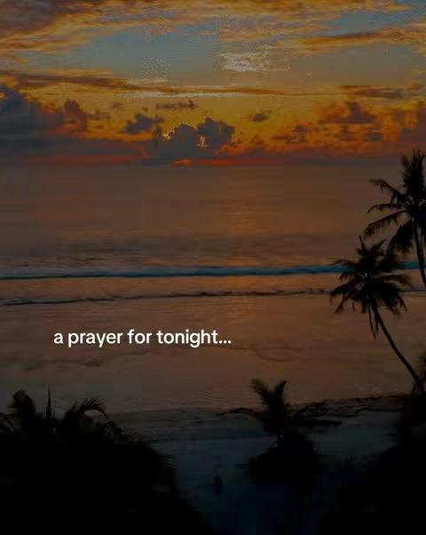 A serene scene featuring a sunset over the ocean. The sky transitions from orange and yellow to blue with some clouds. Silhouette of palm trees can be seen in the foreground.