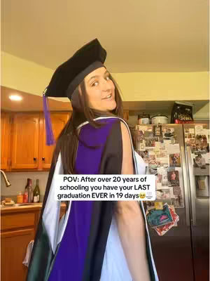 A young woman in a graduation gown and cap smiles, partially turned towards the camera. The background is a cozy kitchen with wooden cabinets and a stainless steel refrigerator. Text overlays state the woman is about to graduate and become a wife.