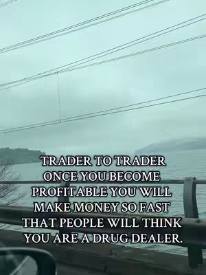 The cover image captures a cloudy, overcast day scene with power lines visible across the top. Below, a body of water is seen in the background. Overlaying the image is white text with dark shadow, containing a motivational quote.
