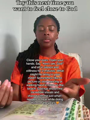A woman sits in a chair with her eyes closed, and her hands are out to the sides, palms up in front of her. Text overlays the woman and the image background of a wall and a window. The woman is wearing an orange shirt.