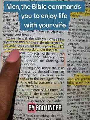 A hand points to text highlighted on a Bible page. The text has a blue overlay with white lettering.