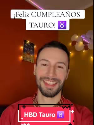 A man with fair skin smiles at the camera. He wears a red shirt and a patterned collared garment underneath. Behind him, the wall is split into orange and yellow. There are decorative fairy lights and a small image. The background features balloons. Text overlays read '¡Feliz CUMPLEAÑOS TAURO!' and 'HBD Tauro ♉'.