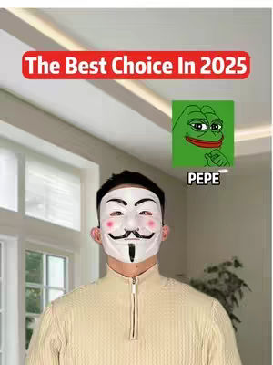 The image shows a man wearing an Anonymous mask with a Pepe the Frog meme in the top right corner. The man is centered, wearing a tan sweater. The background is a lightly lit room with a window visible on the left side.
