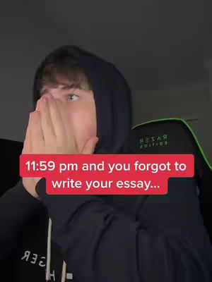 A young man is shown from the chest up, wearing a black hoodie and covering his face with his hands. A red banner at the bottom has time and essay-related text.