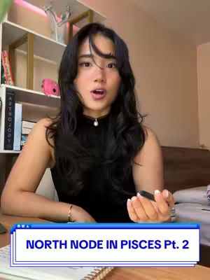 A young woman with long black hair and an open mouth sits at a desk in a room with shelves and a bed. The cover image has a text overlay on the bottom.