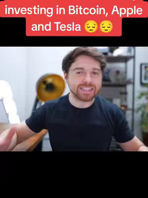 A man in a black T-shirt is speaking to the camera with his hands gesturing outward for emphasis. Behind him, a golden lamp and a messy shelf are barely visible, with text overlayed at the top and a large black box covering the bottom part of the image.