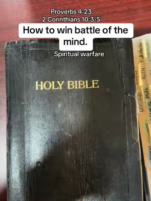 The cover image shows a close-up of a black Bible, open slightly to reveal the golden pages. A white rectangular text box is positioned above the Bible, displaying text in a clean black font. The pages of the bible are visible with scripture references in golden letters.
