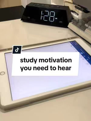 The cover image shows a white desk with an iPad displaying text, a black digital clock with the time 1:28 AM, and a keyboard. The iPad has a black TikTok icon in the top left. The text reads "study motivation you need to hear". The background is blurred, showing a generic office setting.