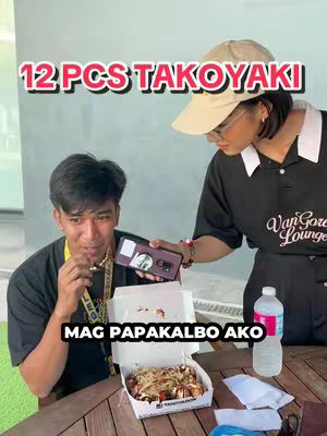 Two people are featured, one eating takoyaki and the other holding the phone with takoyaki on the table, there is a text overlay at top and another at the bottom.