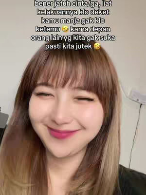 A close-up shot of a young woman with long hair that has a gradient from brown to blonde. She's smiling with closed eyes and pink lipstick. Text overlays appear at the top of the image.