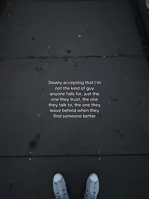 A person's feet are visible, wearing light-colored sneakers, on a grey surface that appears to be a walkway or pavement. Above the feet, a statement in white text is printed on the cover, and the background is a dark grey that gradually fades. The shot is taken from the point of view of the person's legs.