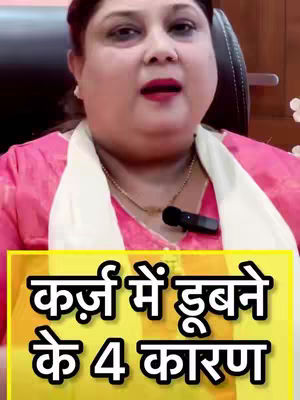 A woman with dark hair and a neutral expression is facing the camera. She's wearing a pink top and a white scarf. Behind her is a black chair. A yellow-colored rectangle is overlaid at the bottom with text in Hindi.
