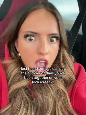A close-up shot of a woman with wide eyes and an open mouth, displaying a shocked expression. The background is blurred, and text is overlaid on the image.