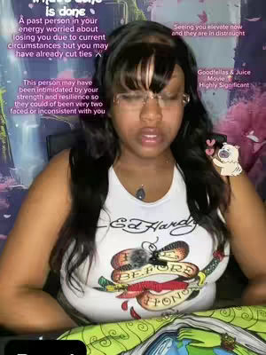 A medium shot of a woman in a white top, wearing glasses and looking down. Text overlays are placed in the image. The background is blurred with some pink and blue colors.