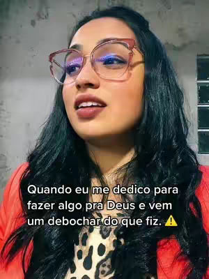 A woman with dark hair and glasses is facing the camera. The image is set against a neutral background. Text overlayed on the image criticizes those who mock or look down on the creator's dedications. The woman's eyes are expressive.