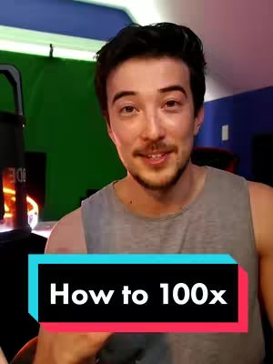 A man with dark hair and stubble smiles directly at the camera, set against a green screen and a partially visible blue wall and desk area. A text overlay at the bottom, inside a black and colored rectangle, reads 'How to 100x'.