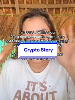 A woman with light brown hair is positioned in front of a natural, straw-like canopy. The main focus is on the woman's upper body, with her wearing a white t-shirt. She is holding up her hands, with one hand angled as if she is showing something and the other hand up near her face, with the text "Crypto Story" overlaid. The text "I'm bored. tell me your...", with the rest of the text, is written around the overlay.