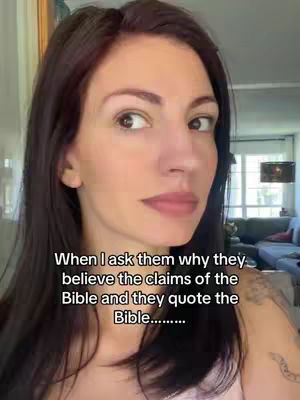 A woman looking slightly to the side with text overlayed at the bottom. The woman has dark hair and is wearing a pink top. Behind her is a well-lit room.