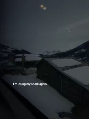 The image is a dark, moody shot of a snowy landscape at dusk or night. A building is in the foreground, and the sky is overcast. The primary colors are dark blues, grays, and whites. Text is overlaid on top of the image.