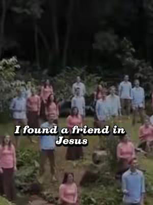 A group of people, likely a choir or religious group, stands outdoors. Text overlayed reads, "I found a friend in Jesus". The overall color palette is muted, with natural greens and browns dominating.