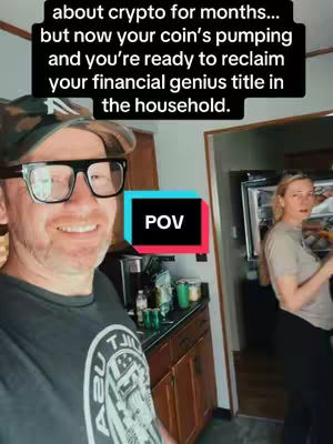 A selfie-style shot with a man in the foreground and a woman in the background. The man is smiling and wearing glasses, a hat, and a t-shirt. A kitchen setting is visible behind them. A text overlay features white text on a black background.