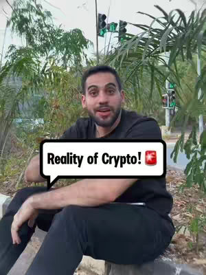 The cover image shows a man sitting and talking, likely explaining a topic, outdoors. The man, wearing a black t-shirt, is positioned in the foreground. A text overlay, styled as a speech bubble, stands out. The background includes foliage, greenery, and partially visible traffic signals, giving the shot a summery feel. The overall composition is a medium shot, focusing on the man and his environment.