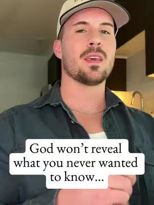 A man wearing a backward baseball cap is in the foreground, speaking. A white rectangle with the text "God won't reveal what you never wanted to know..." covers the bottom third of the image. The background shows a bit of a kitchen.