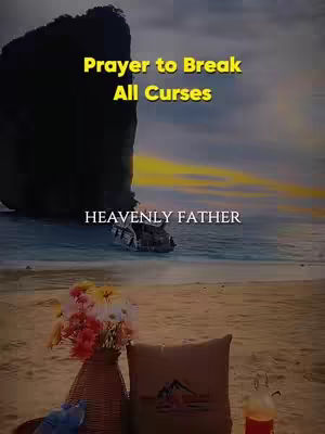 The image shows a beach scene with a large rock formation in the background and text overlayed at the top and bottom saying 'Prayer to Break All Curses' and 'Heavenly Father'. In the bottom foreground are decorative items on the sandy beach, a bouquet of flowers.